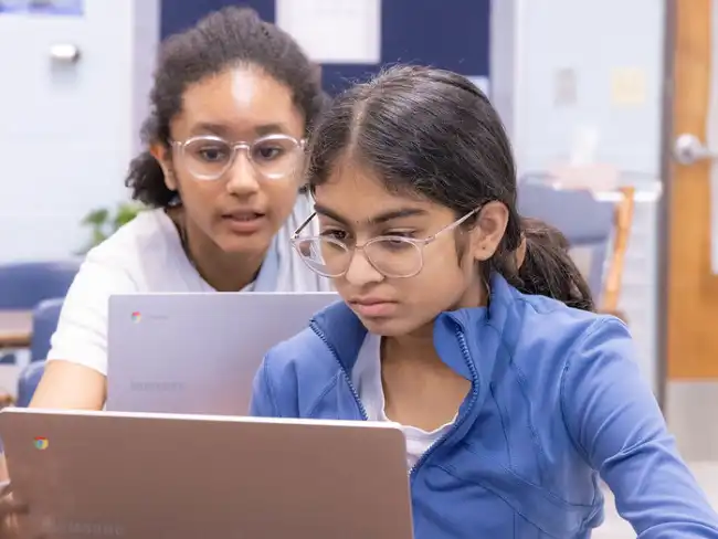 Students working with AI