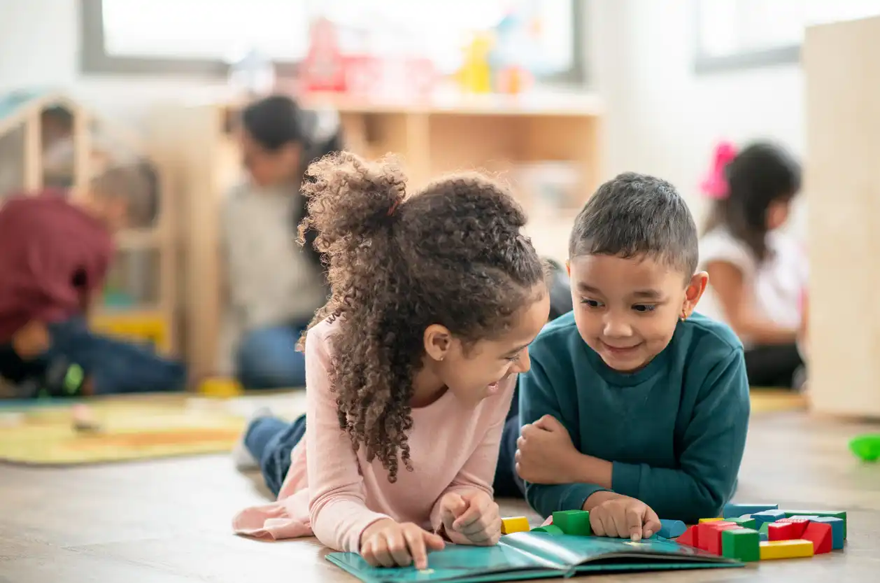 two kids playing on the floor