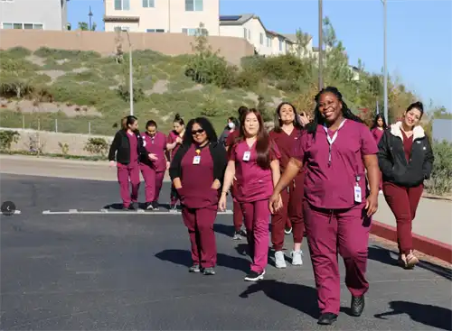 Phlebotomy Students walk near HOC entrance