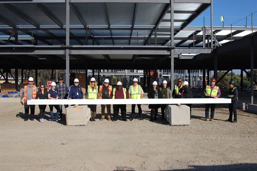 Construction crew with the last steel beam