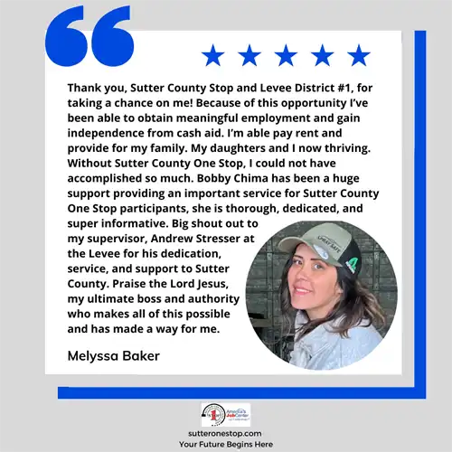 A smiling female wearing a baseball hat.