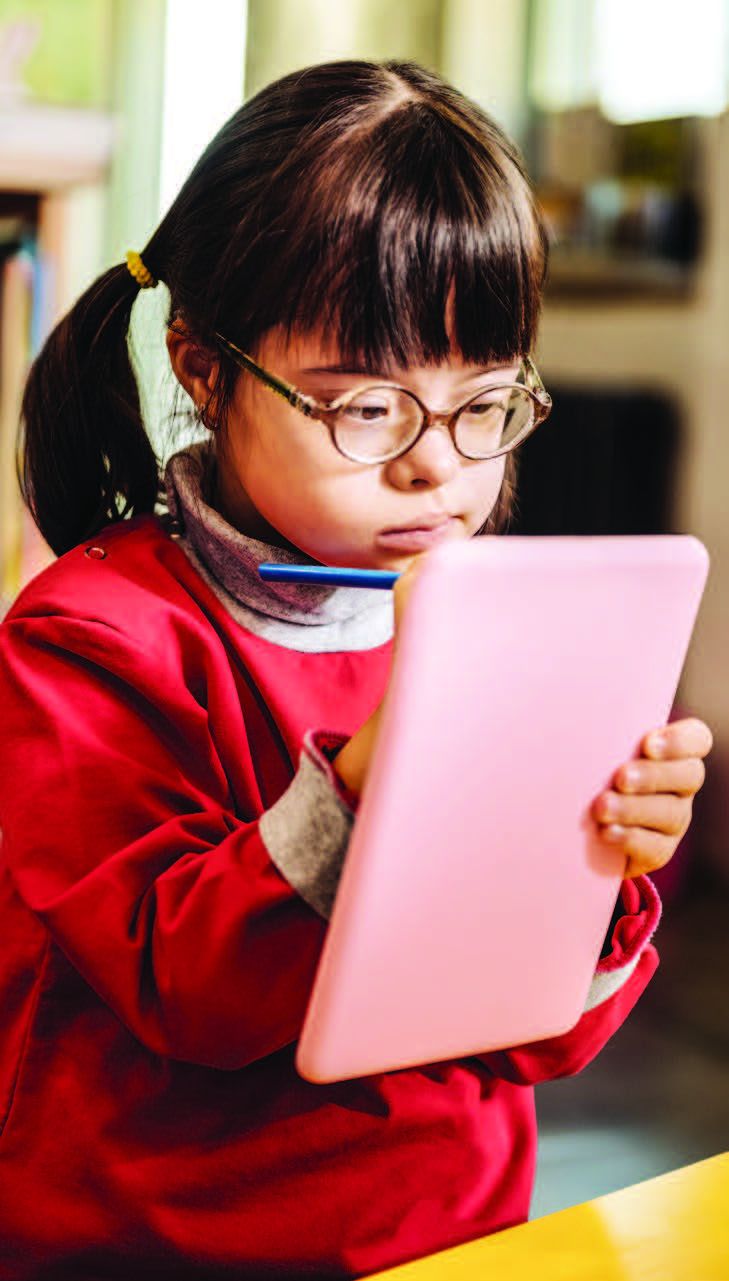 Young Girl Writing On Tablet