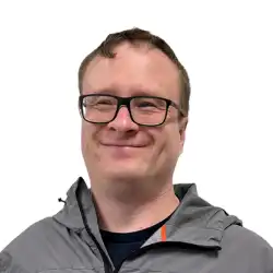 man with glasses smiling