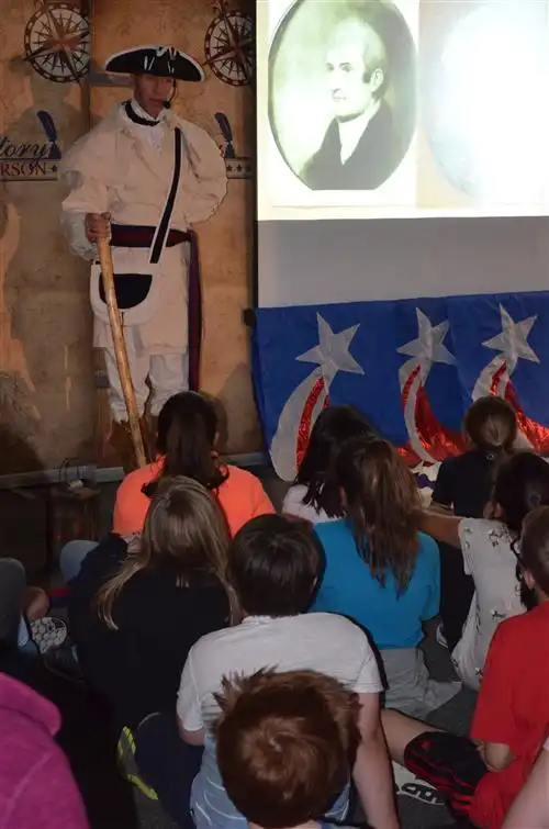 Actor in bucksin period costume and tri-corner hat portrays explorer Meriwether Lewis 