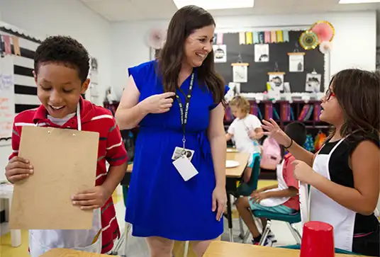 Teacher in a classroom helping students