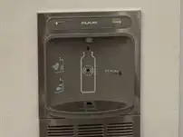 water refill station with "got water" sign