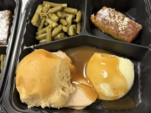 Turkey, gravy, mashed potatoes, green beans, pumpkin bread