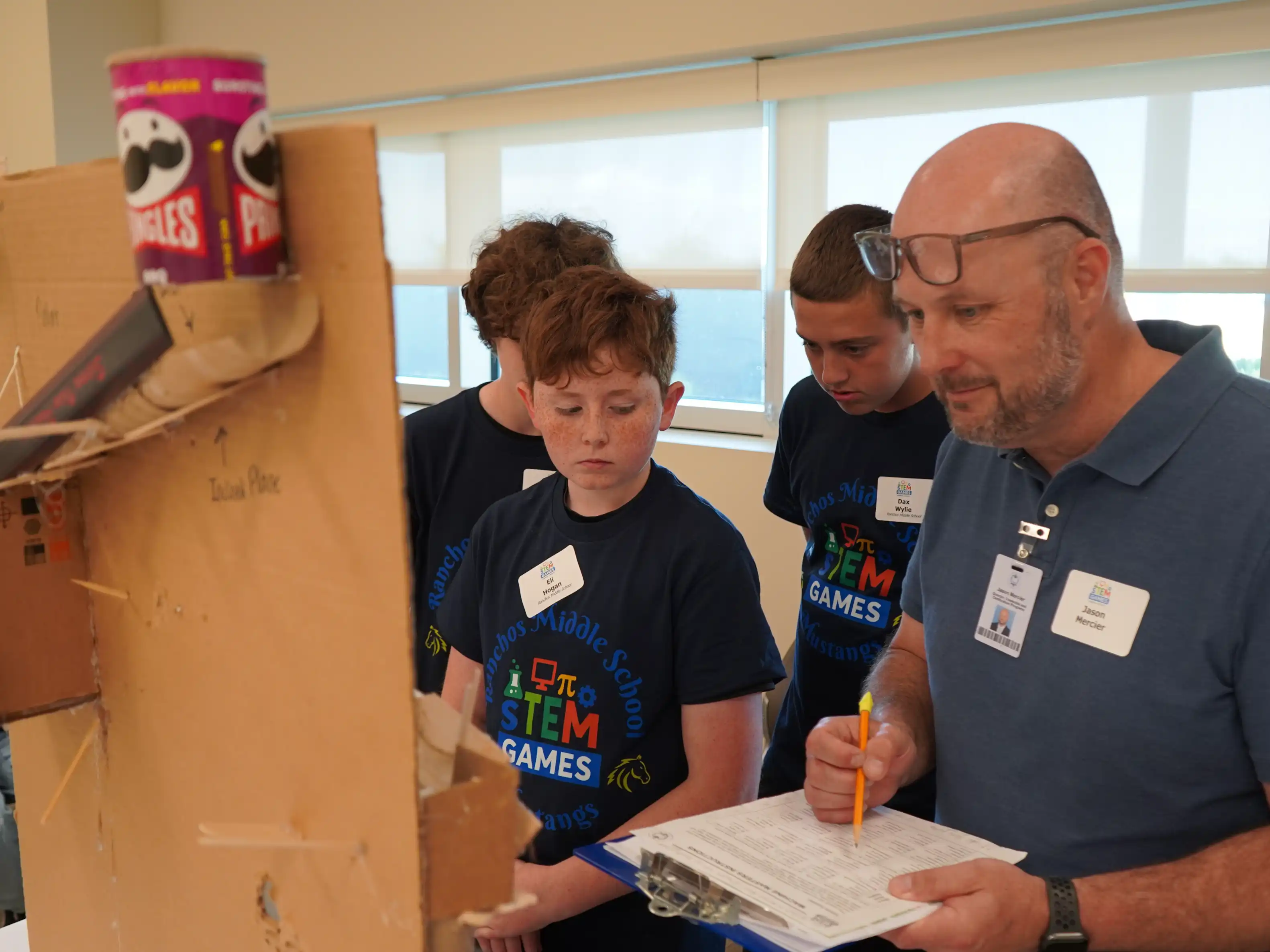 Students run their rube goldberg machine for machines at the Machine Masters event at STEM Games