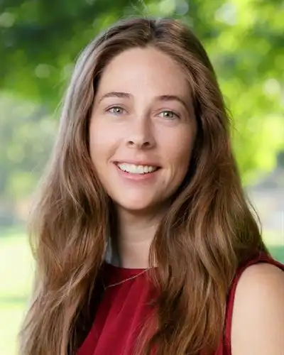 smiling woman with long light brown hair