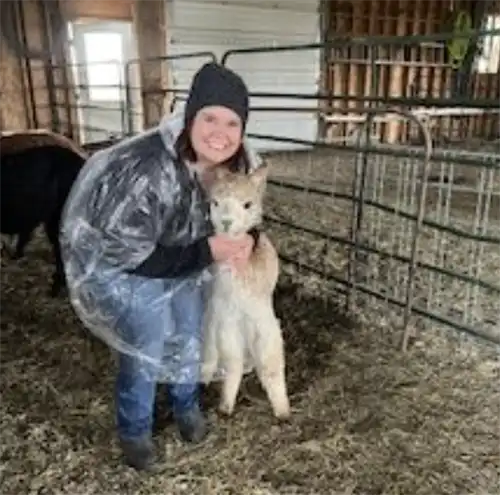Jacqui Henry and an alpaca
