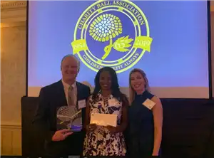 North East Foundation leaders receive a grant check. 