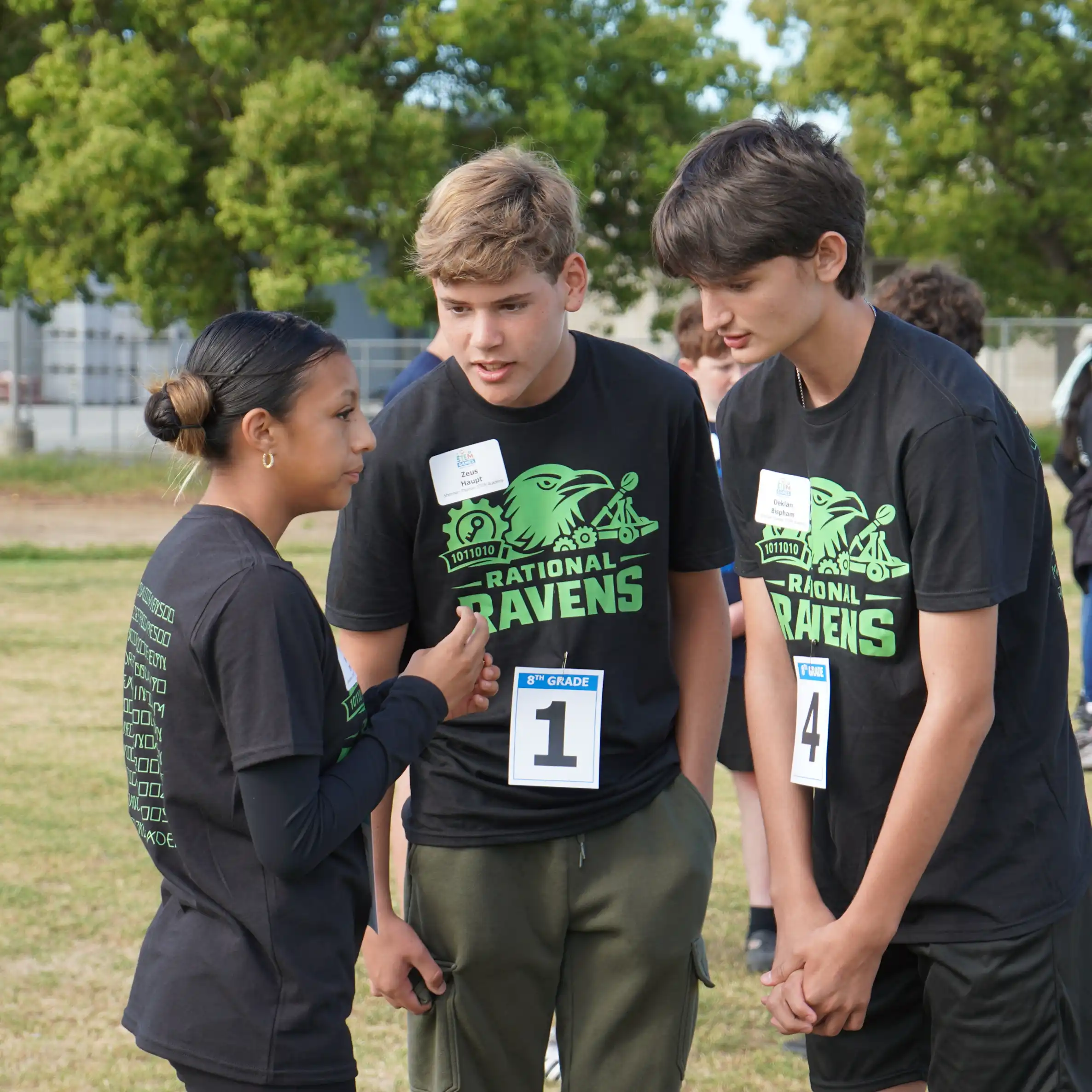 Students from Sherman Thomas STEM Academy collaborate on math problems during the Formula Race portion of the STEM Games event