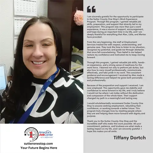 A smiling woman sitting at a desk in an office. 