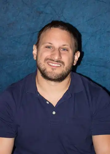 camozzi in blue shirt
