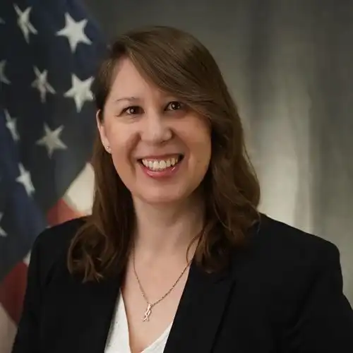 Woman in front of flag