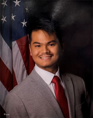 student photo with American flag in background