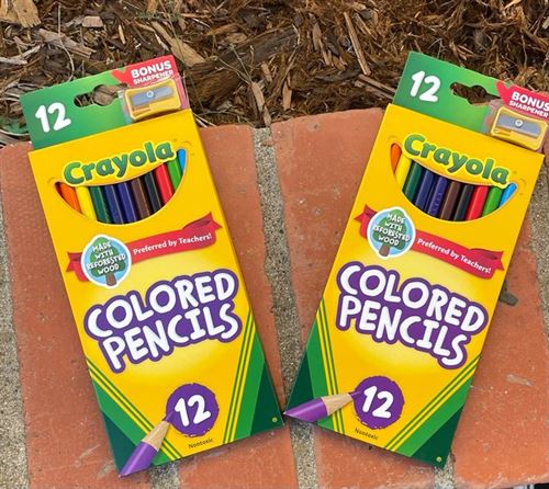 two packs of Crayola 12 pack colored pencils on brick background