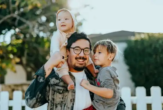 Man smiling with his kids