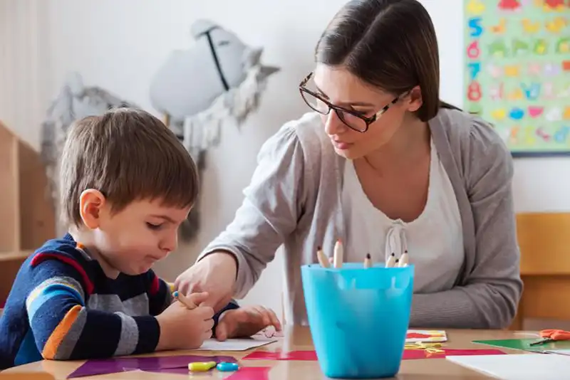Teacher and Student in Classroom