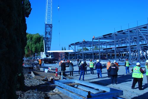 Watching the beam being placed