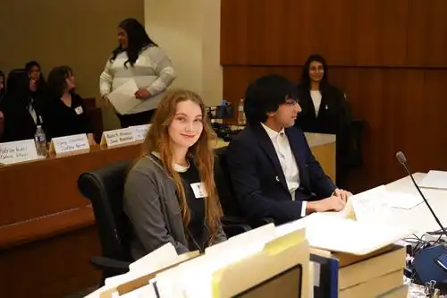 Students sitting at in the courtroom, preparing to begin Mock Trial at the Madera County Courthouse