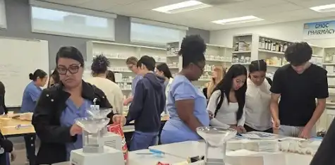 Pharmacy students practice their skills in the lab