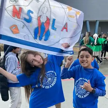 NSLA students with NSLA flag