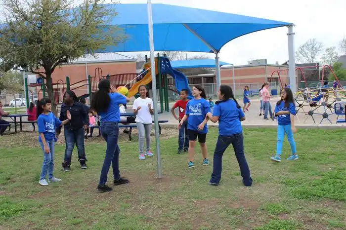 Students playing at the new park. 