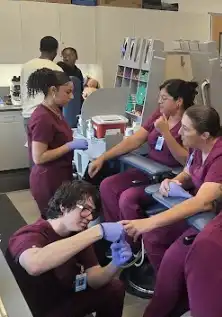 Phlebotomy students get hands on experience in the lab