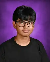 School photo of Manuel Reyes-Herrera with a purple background
