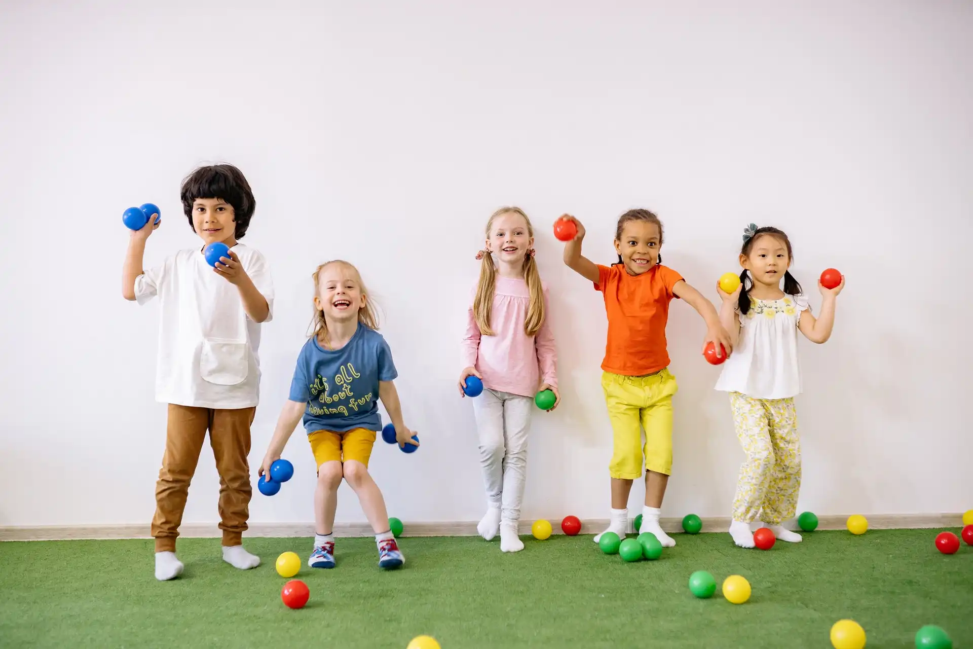 students throwing balls for fun