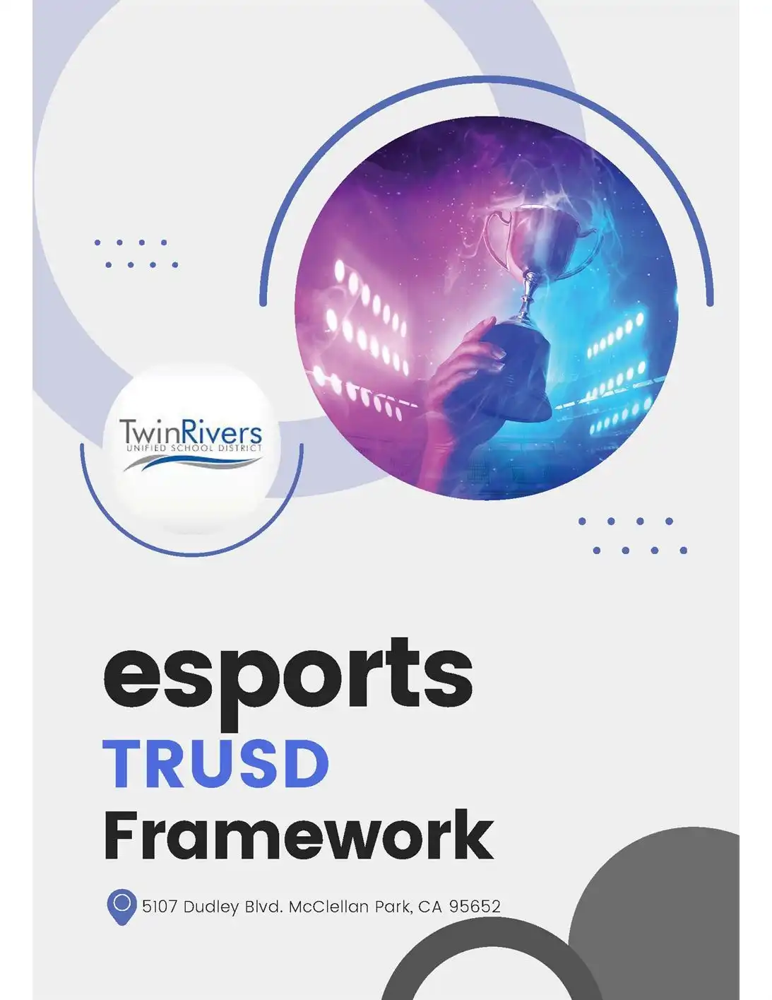 Cover of the TRUSD Esports Framework featuring the Twin Rivers Unified School District logo and an image of a hand holding a trophy in a brightly lit esports arena. Text reads “esports TRUSD Framework” and includes the address 5107 Dudley Blvd., McClellan Park, CA 95652.