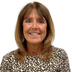 woman with light brown hair smiling