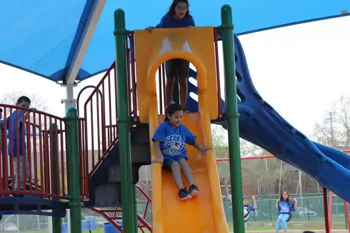 Students enjoy playing on the covered playground areas at the Serna SPARK. 