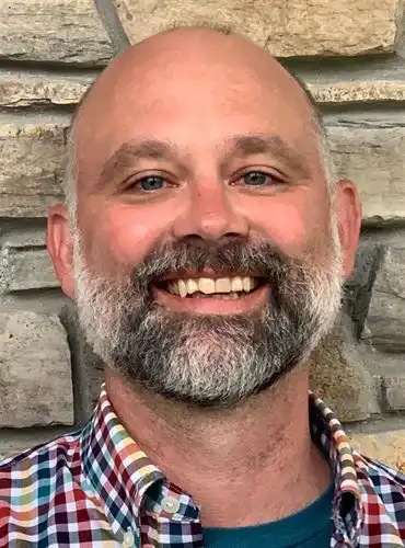 man in checkered shirt