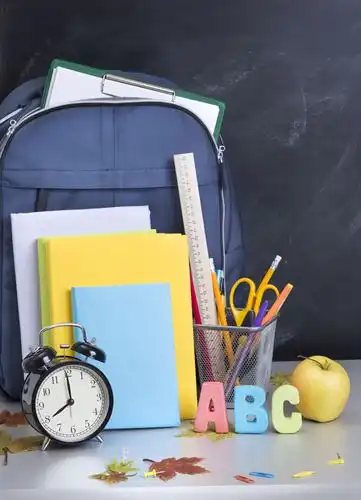 School supplies next to a backpack