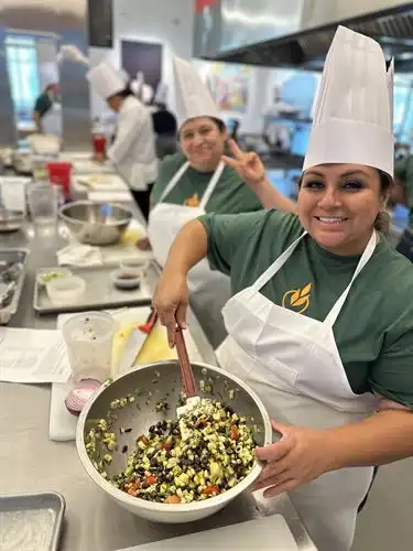 Yesenia mixing a salad