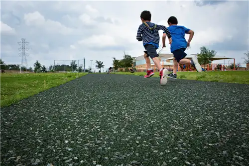 Porous pave walking tracks with two boys running