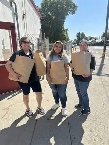 staff handing out bags