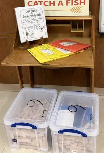 Desk with folders and boxes of Keva planks