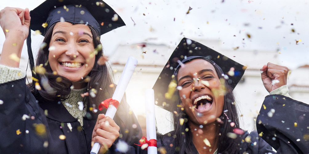 Photo of graduating students seen through confetti
