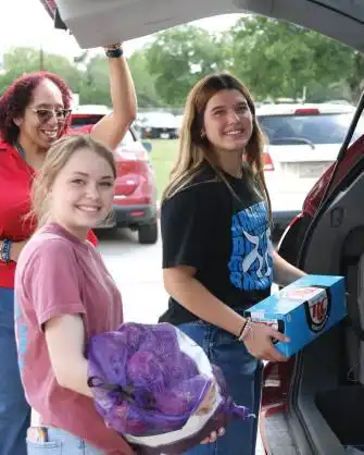 Students helping out at Summer Feast